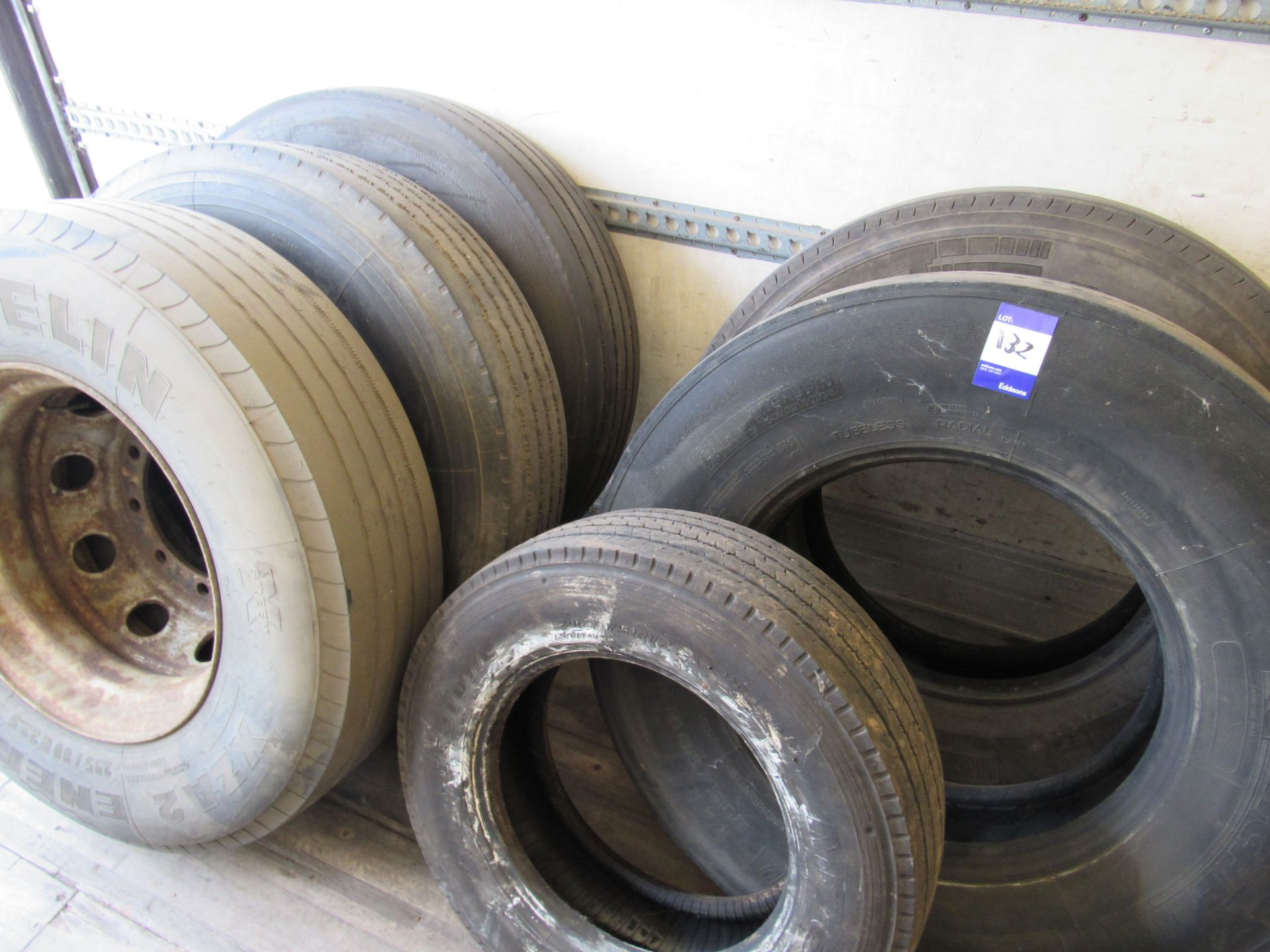 Quantity of Various Tyres, approx. 17 (some scrap), with 2 x Tyre Racks