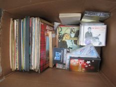 Box of assorted vinyl records, CD's and DVD's