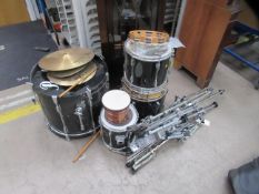 A pearl drum set together with music stand and tambourine