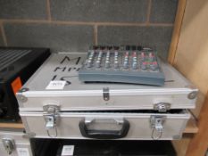 A Spirit Notepad and a Samson MPL 1502 15 Channel Stero Mixer