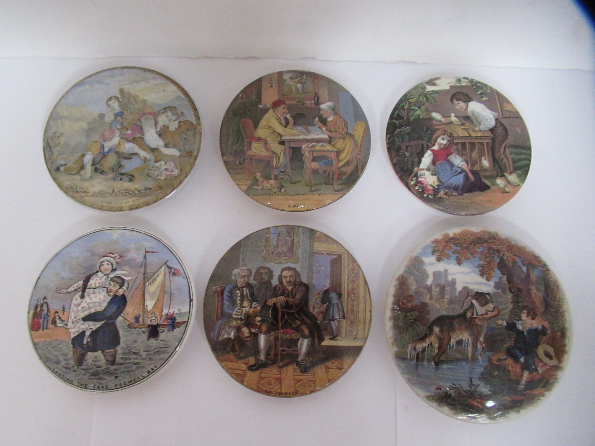 6x Prattware ceramic lids including 'Landing the Fare- Pegwell Bay', 'I See You My Boy', 'Dr Johnson