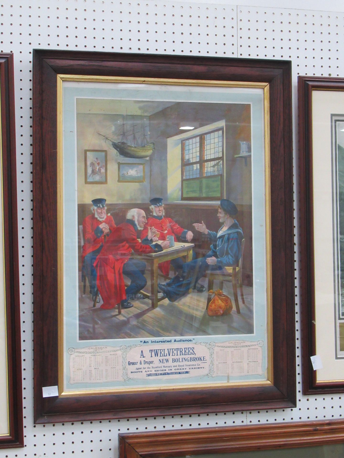 A Twelvetrees Grocer and Draper New Bolingbroke 'An Interested Audience' 1907 calendar in frame (43c