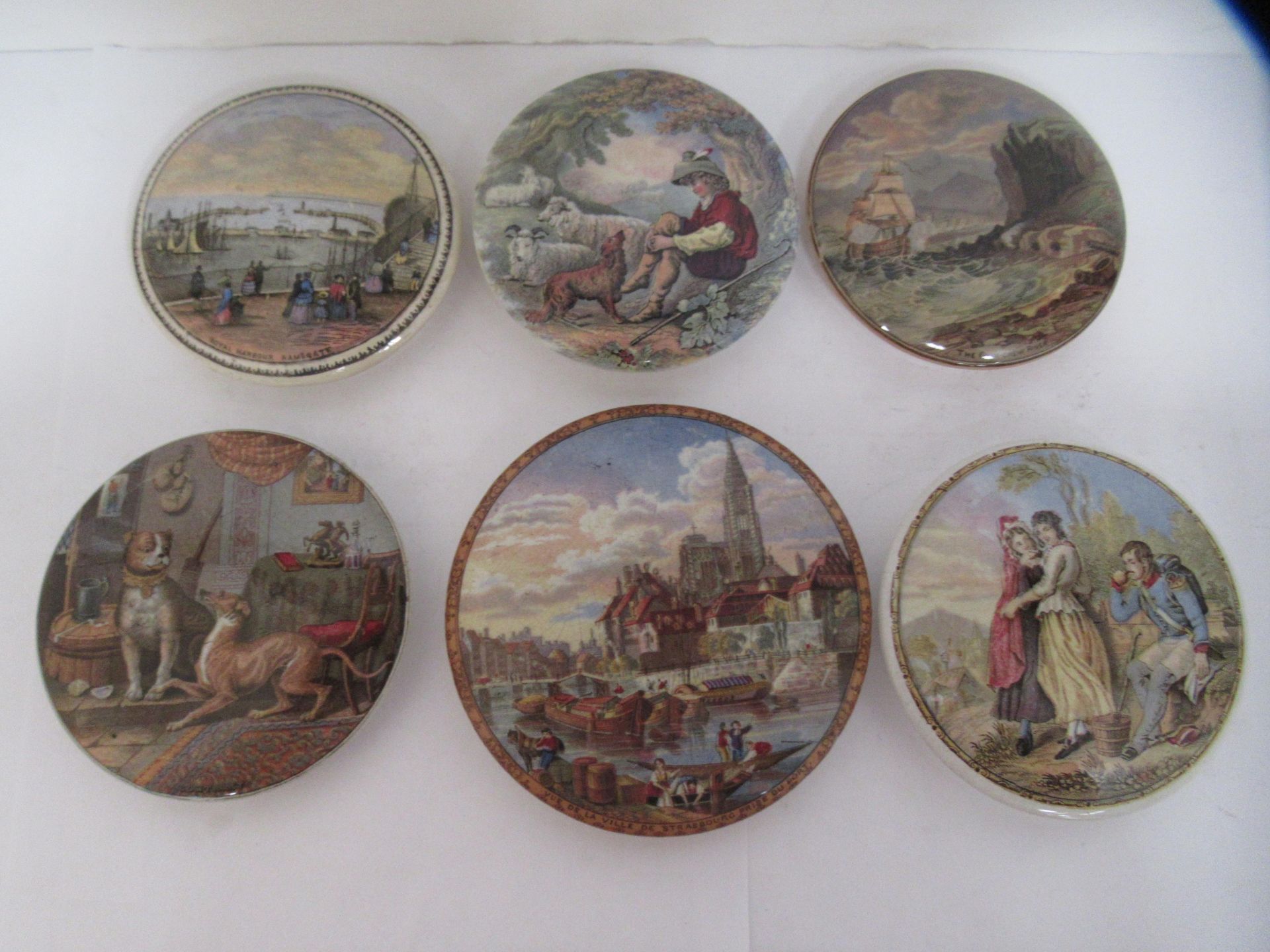 6x Prattware ceramic lids including 'Royal Harbour Ramsgate', 'The Chin-Chew River', 'Contrast', and