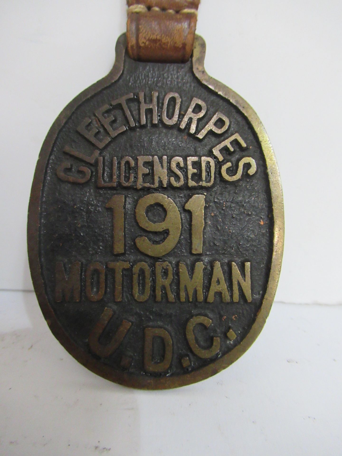 2x Brass Cleethorpes U.D.C 'Attendant' and 'Motorman' wall hanging medallions - Image 2 of 5