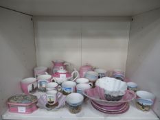 A selection of pink lustreware, mainly with Cleethorpes scenes