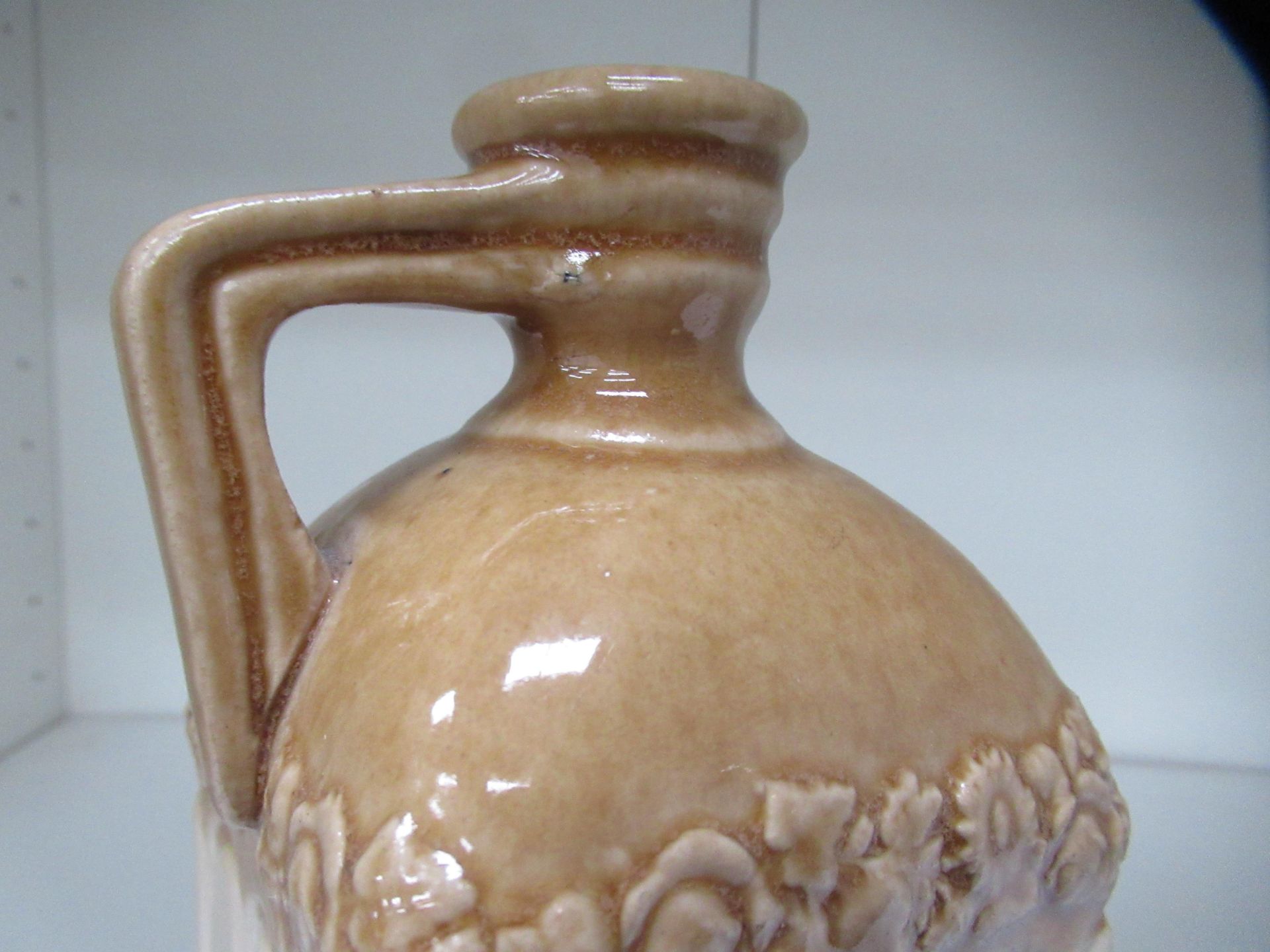 Stone bottle with floral detailing below bottle neck and 'G' stamp on handle - Image 7 of 8