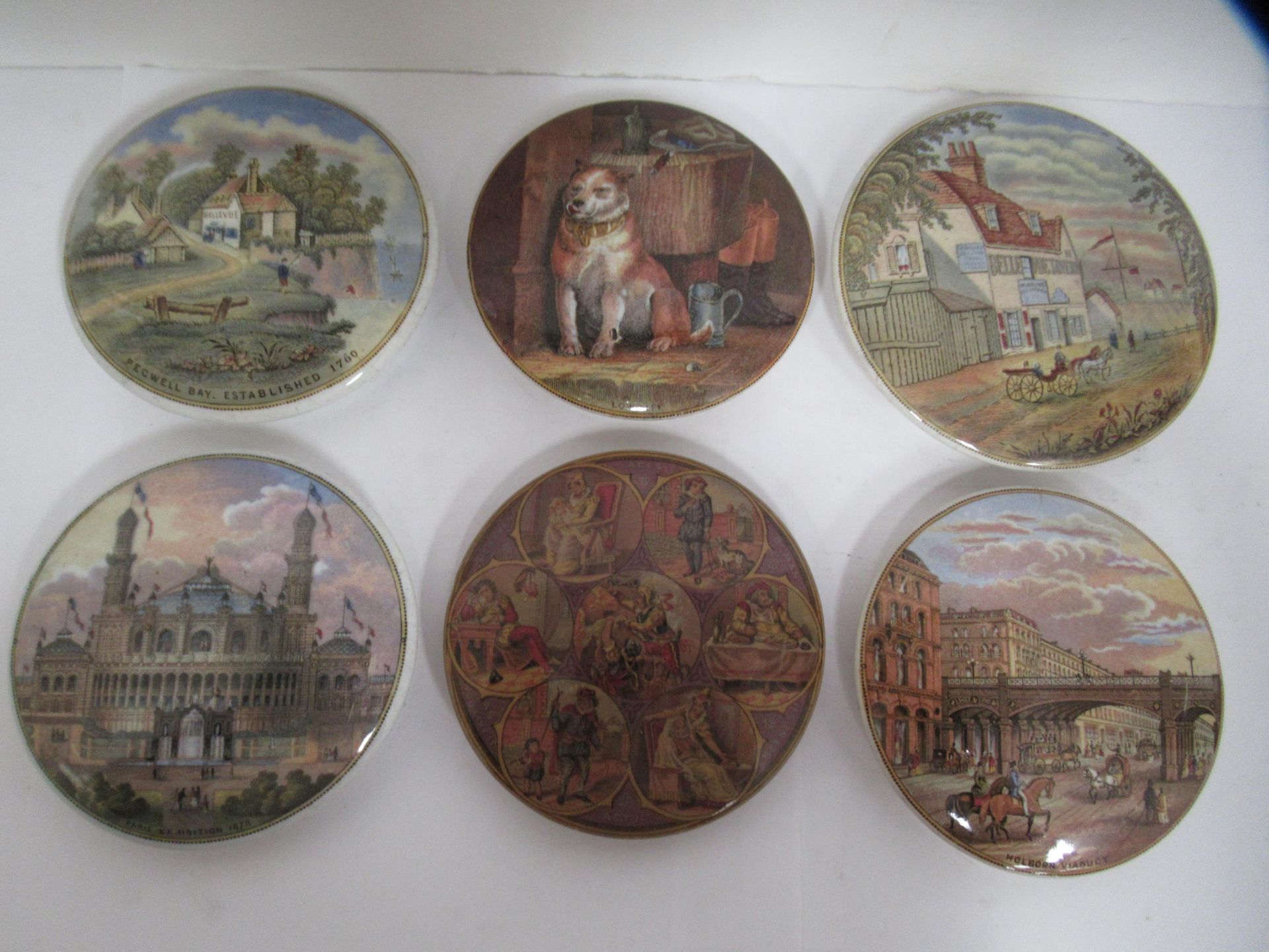 6x Prattware ceramic lids including 'Pegwell Bay', 'Low Life', 'Paris Exhibition 1878', 'Holborn Via