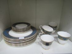 2x Shelves containing Royal Doulton 'Earlswood' and Royal Vale tea cups and saucers