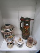 Shelf of German themed items including Tankard, Stein, bottles etc