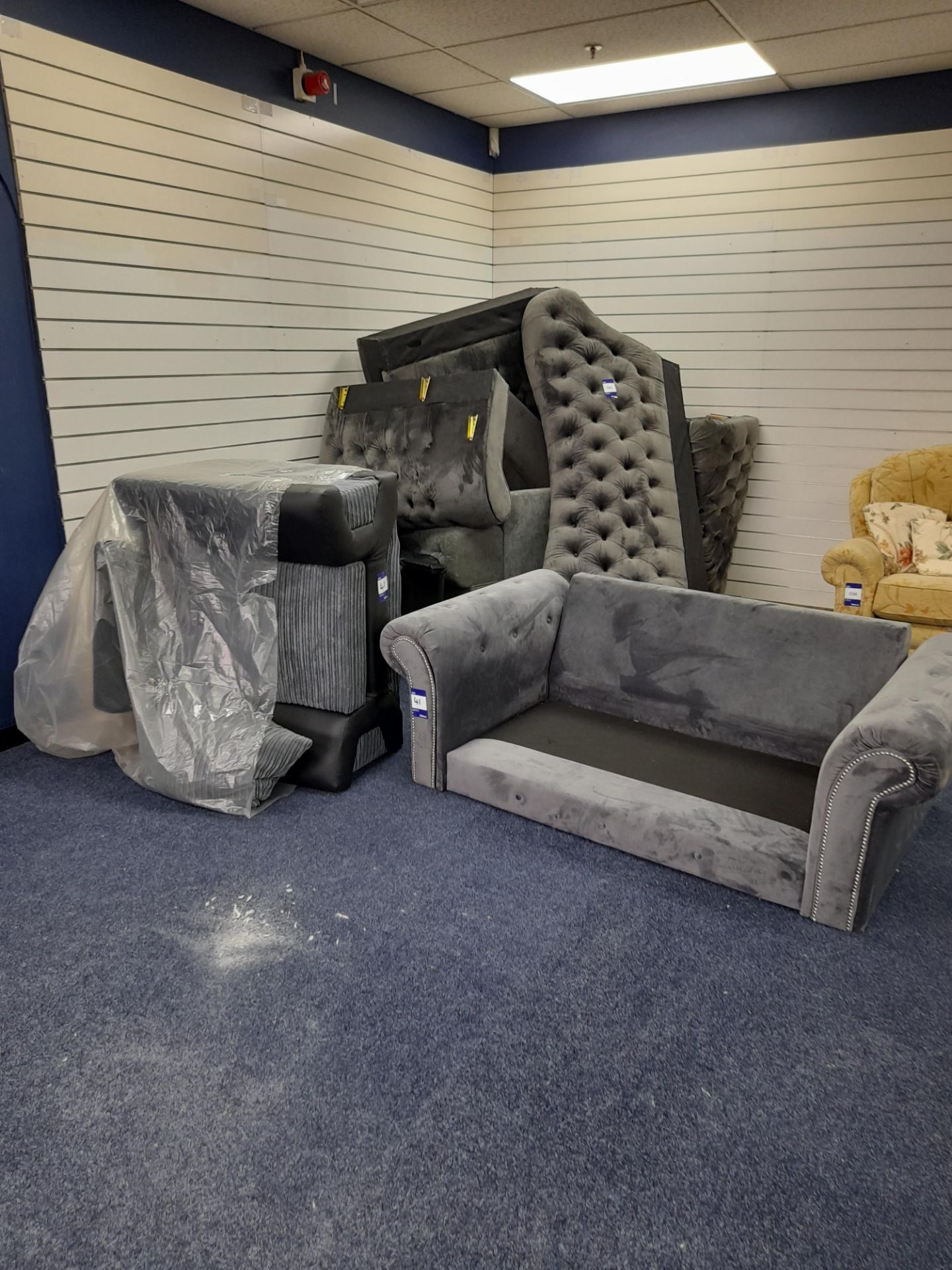 Quantity of incomplete sofas, armchairs etc. (no feet or cushions, or only parts), and large