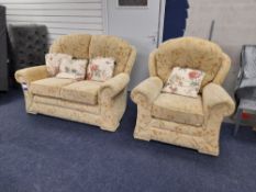 Cream floral patterned fabric upholstered, 2 seater, standard cushioned back sofa with marching