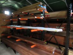 Timber racks with adjustable loading arms