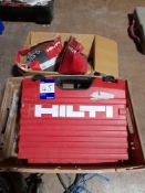 Hilti DX5 nail gun to case, with tray of Hilti consumables