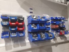 Three section wall mounted plastic storage boxes, with contents