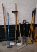 Quantity of various hand tools including spades, scrapers, rakes, etc
