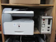A Canon iR1022A printer, a power supply and 2 various electrical boxes
