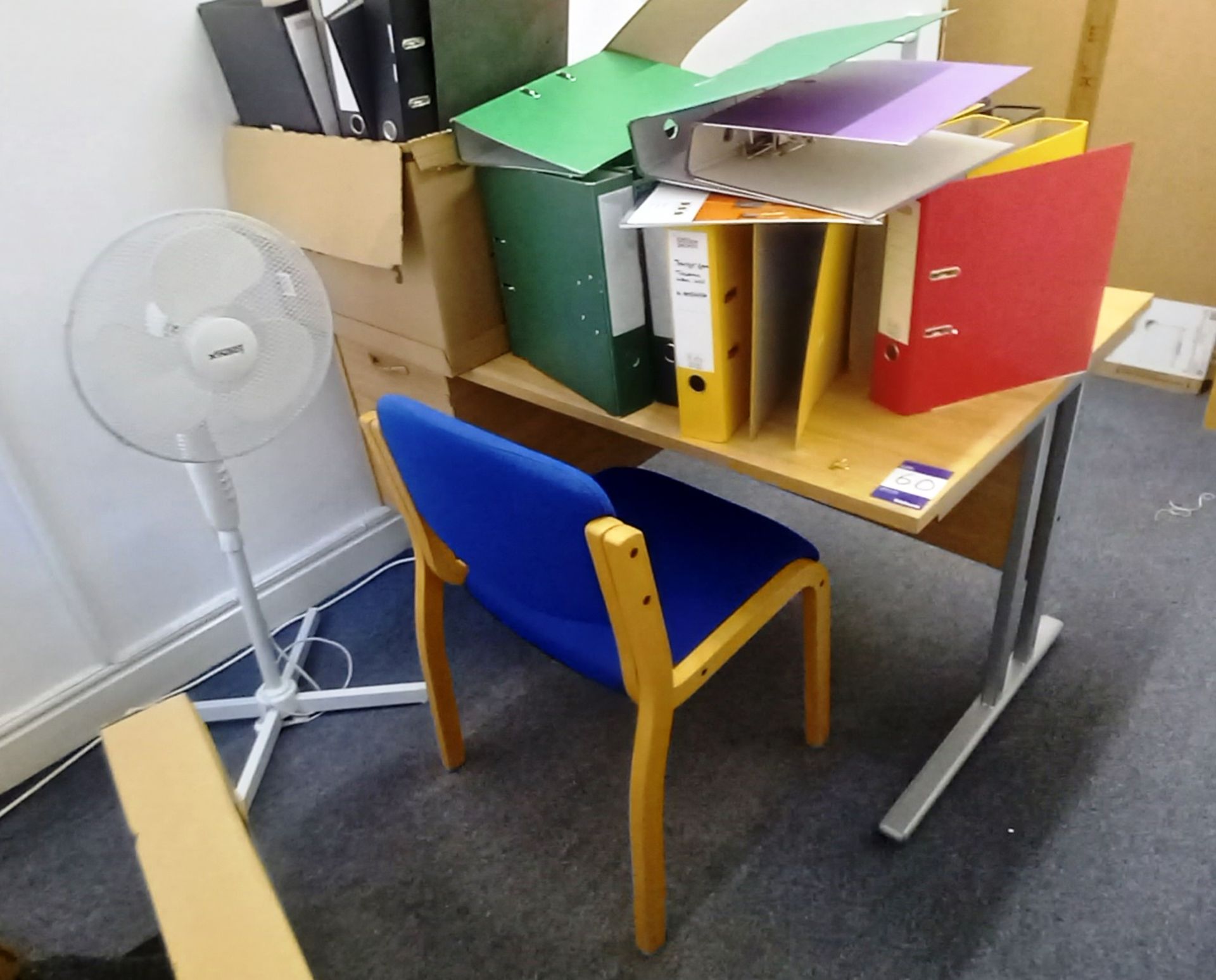 Single pedestal cantilever desk with reception chair, bookshelf and fan