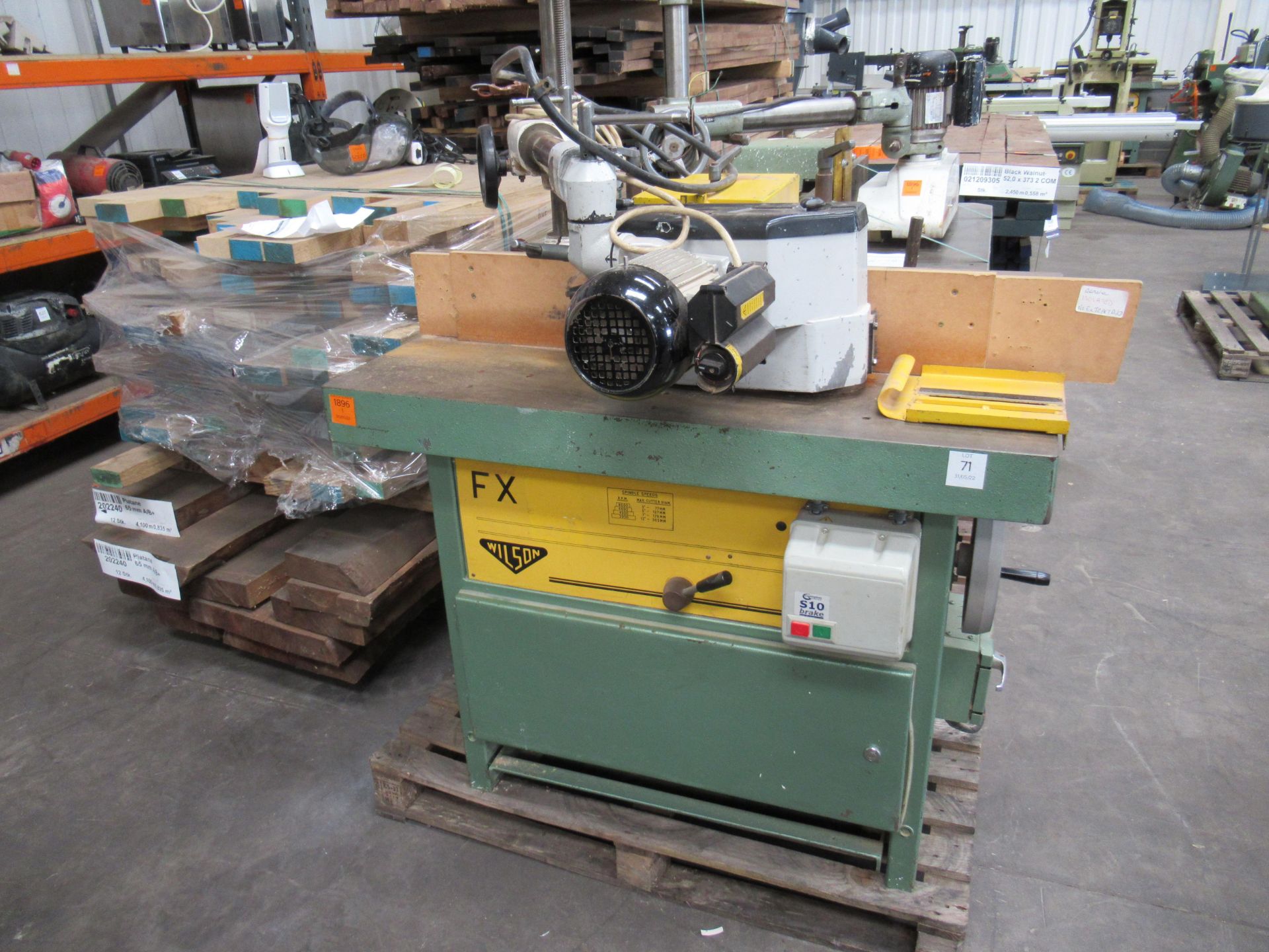 Wilson FX Spindle Moulder with unbranded powered roller feed. Please note there is a £15 plus VAT Li