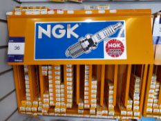 NGK metal wall mountable rack and contents, to include various spark plugs