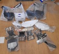 Assortment of MotoX plastic accessories, including various brackets