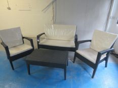 4 piece Rattan effect garden furniture set comprising 2 seater sofa, 2cm chairs and coffee table