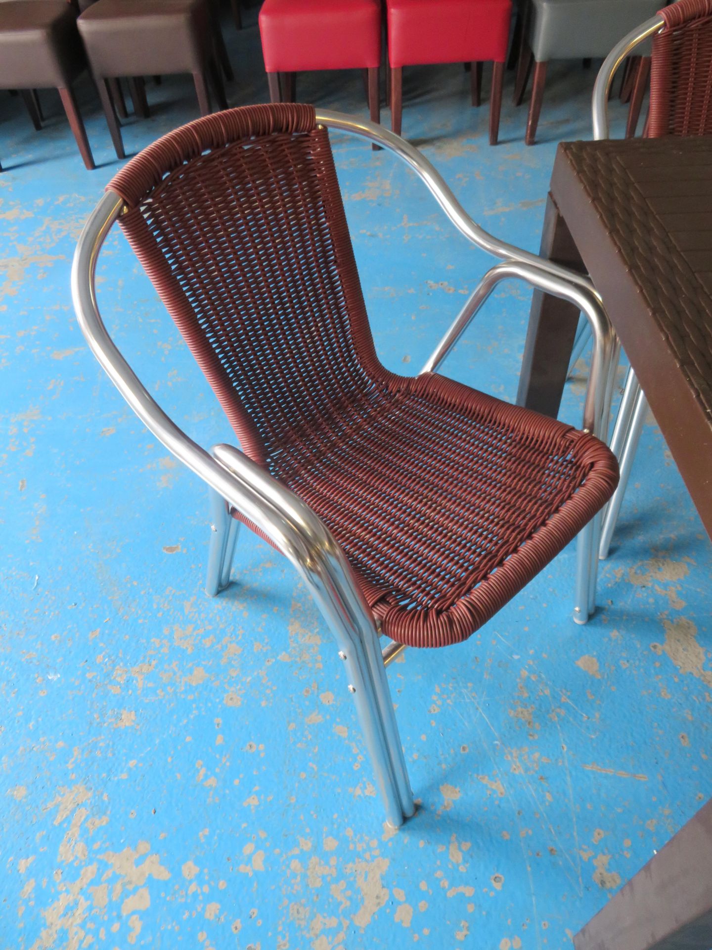 Brown outdoor table 800 x 800mm with 4 "wicker style" steel tubular framed arm chairs - Image 2 of 2