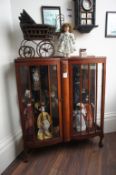 Oak Effect Glazed Display Case with Collection of Dolls & Pram