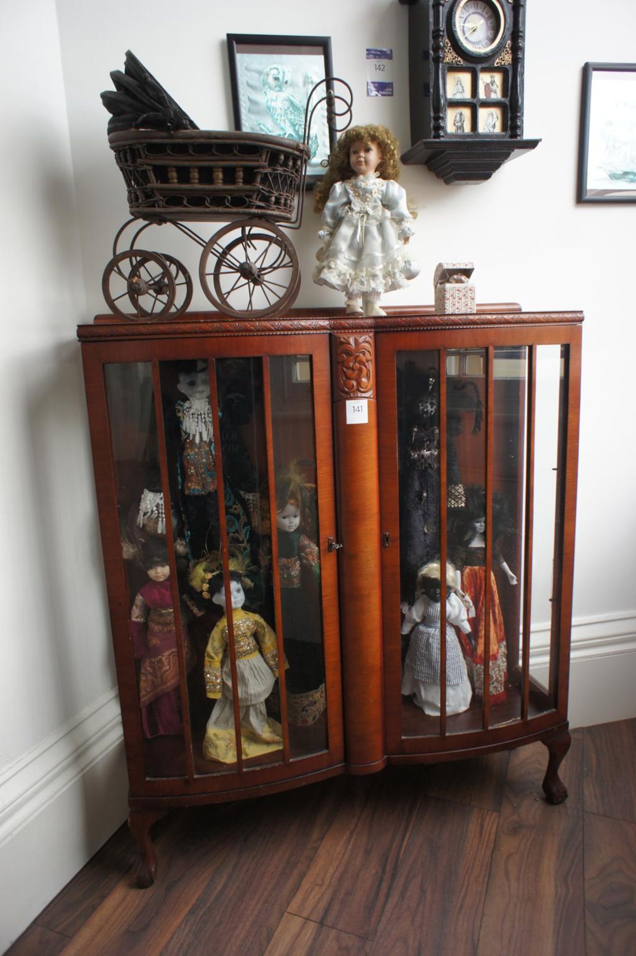 Oak Effect Glazed Display Case with Collection of Dolls & Pram