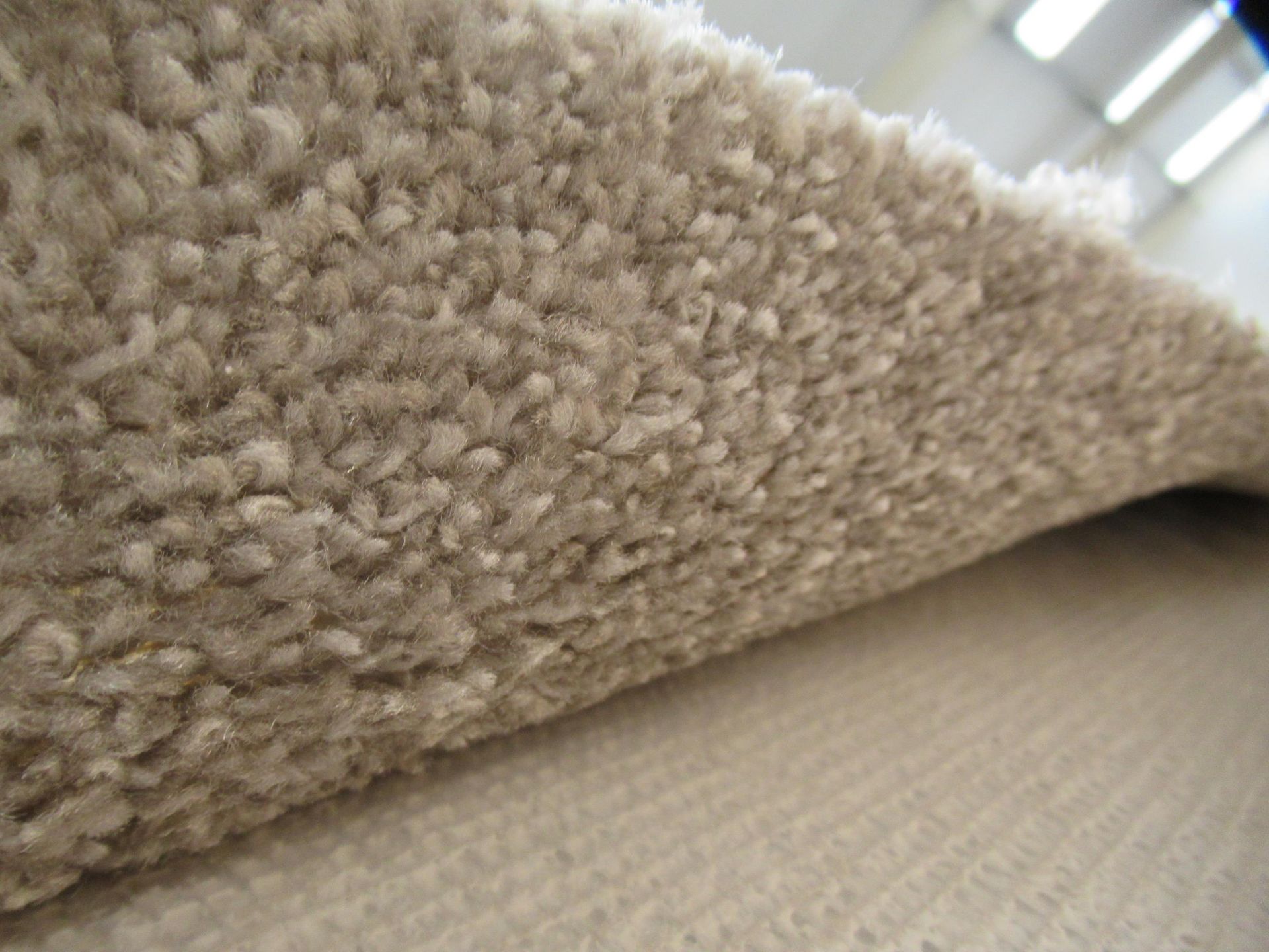 Roll of grey carpet (approx. 30m in length) may have water damage. - Image 2 of 6