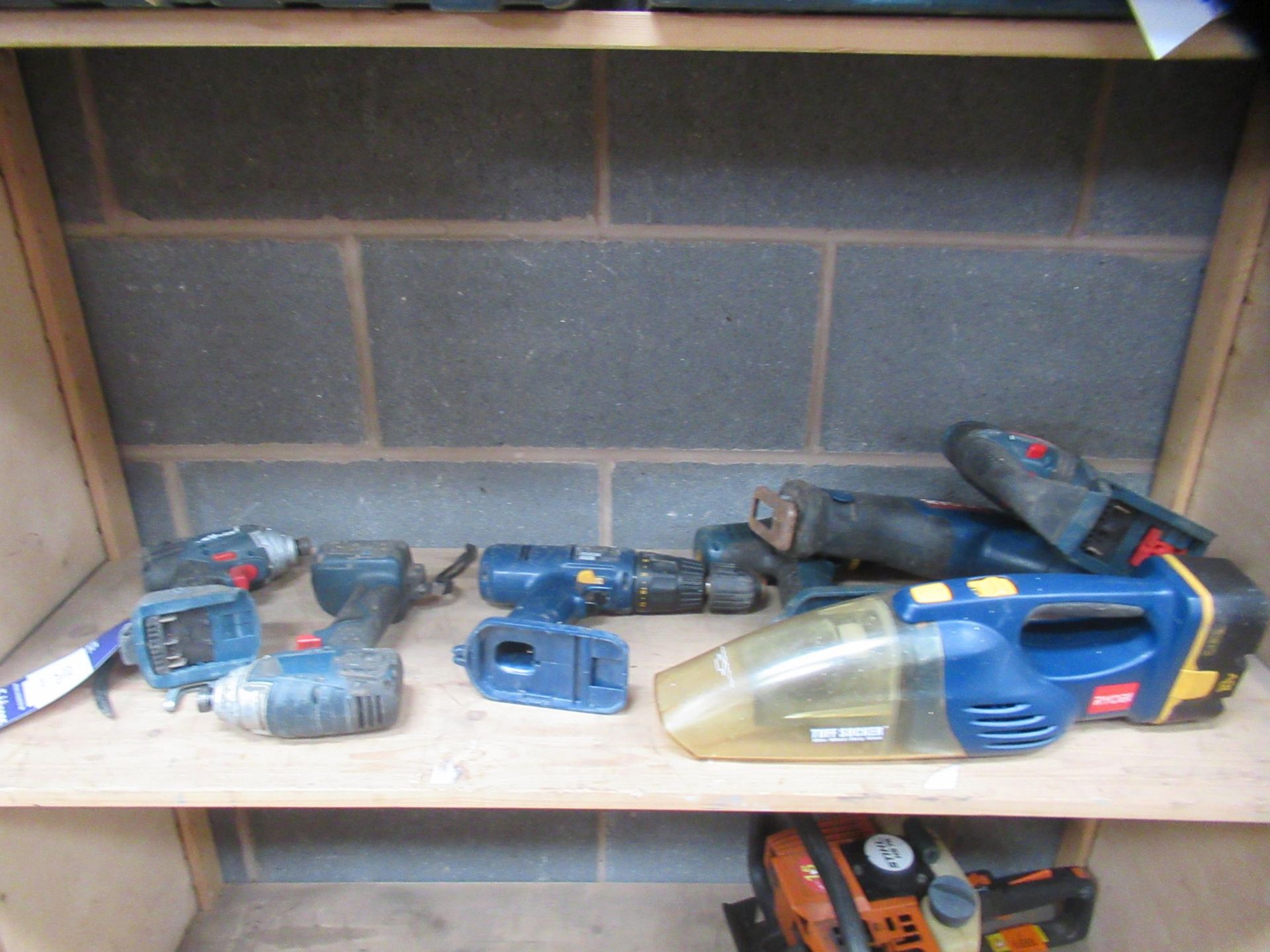 Shelf of Cordless Handtools Including Bosch and Ryob Drills, Vacuum etc