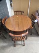 Dark Oak effect Circular Dining Room Table with 4 Spindle back dining chairs