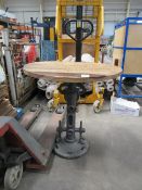 A reproduction cast/wooden top mechanical circular table
