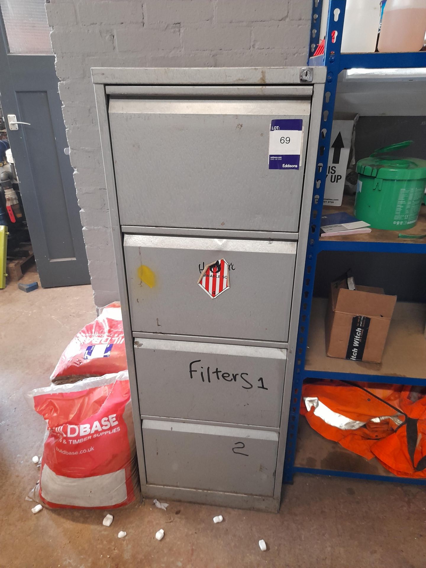 1 x Metal 4-drawer filing cabinet and contents to include air filters etc.