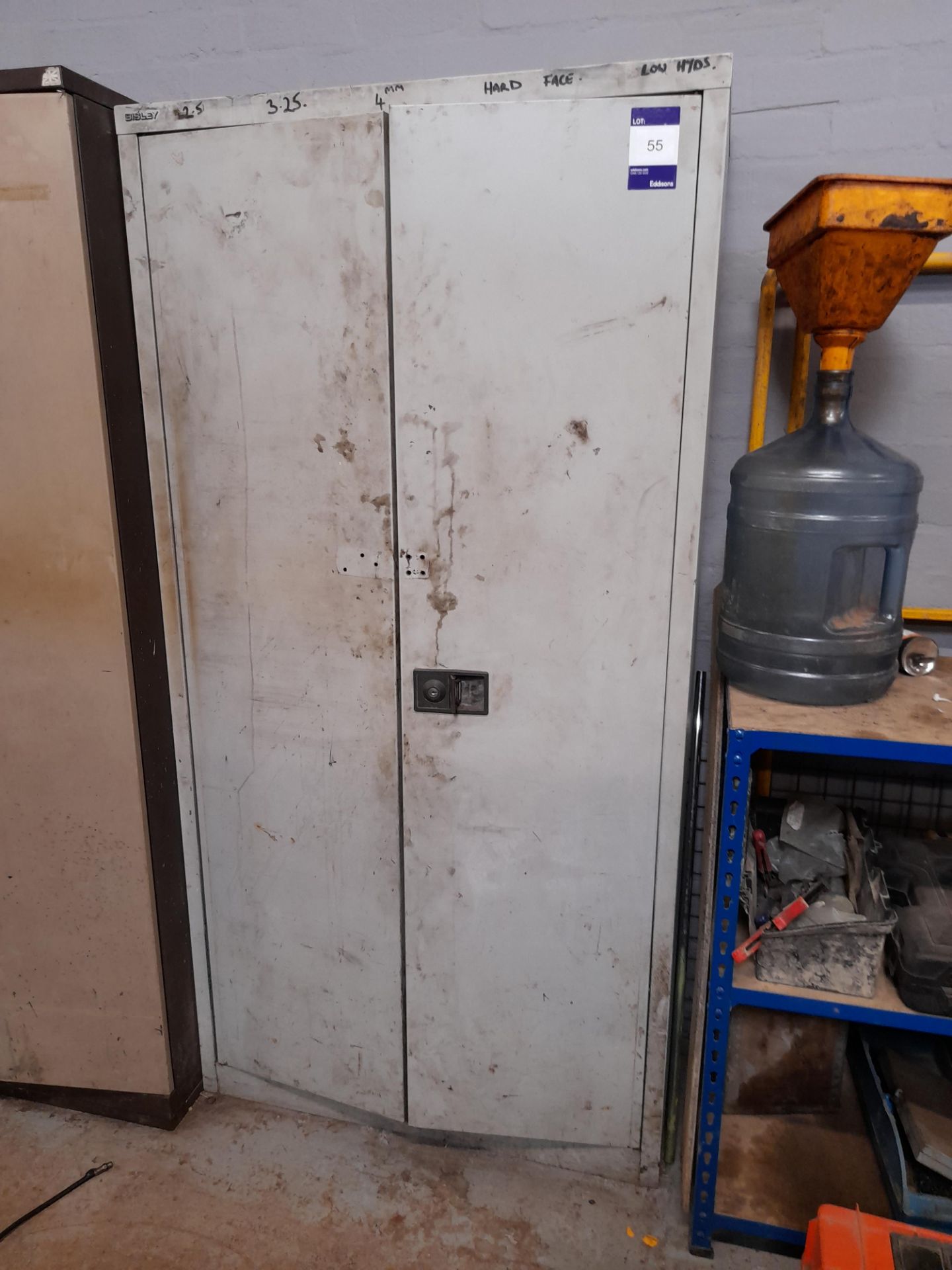 Metal double door cupboard and contents to include