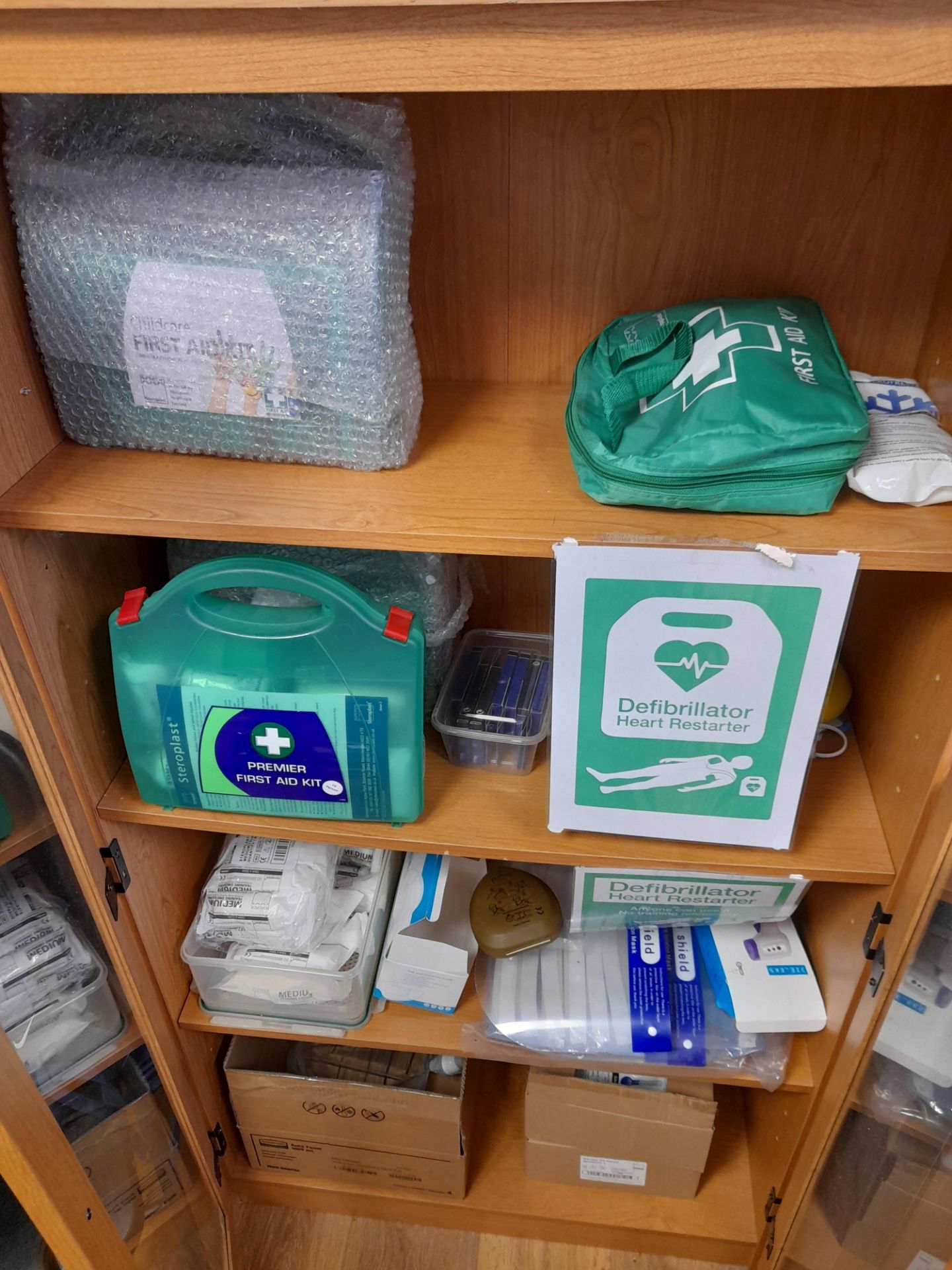 Glazed fronted double door cabinet and contents, to include assortment of first aid supplies - Image 2 of 4