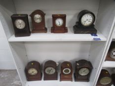 2x shelves of mantle clocks