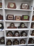 5x shelves of wooden mantle clocks including art deco style clocks
