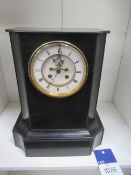Slate mantle clock with brass features to clock face