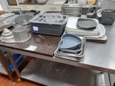 Quantity of commercial chocolate moulding trays, tins, serving trays, cookware etc.