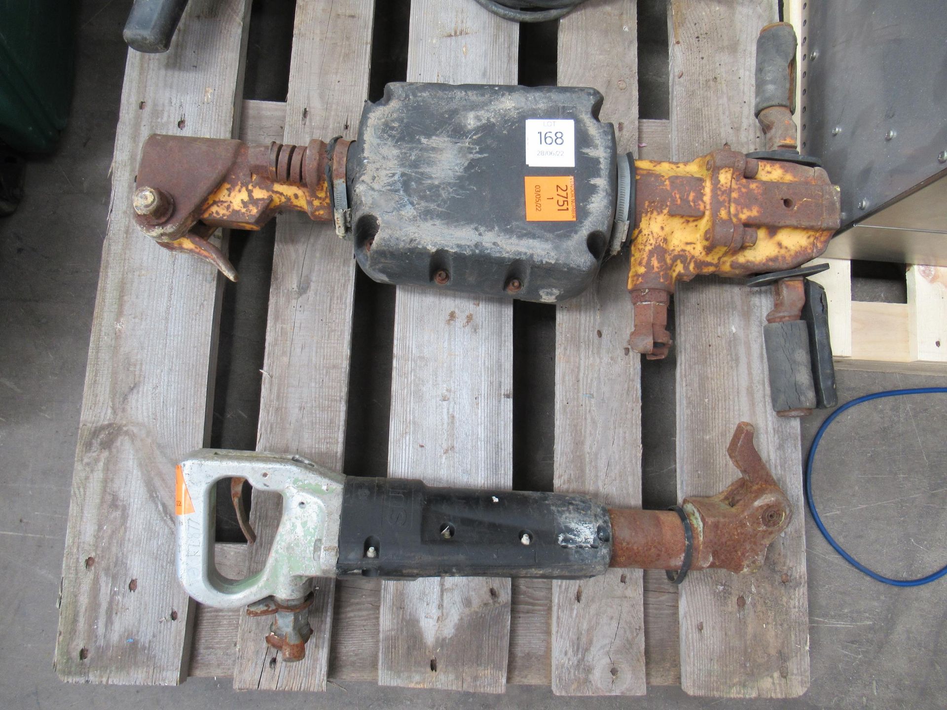 Unbranded jackhammer and another sullair jackhammer