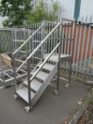 A S/Steel 5 Step Platform on Castor Wheels. Height to Plat 1400mm. W700mm, D1640mm. Please note ther
