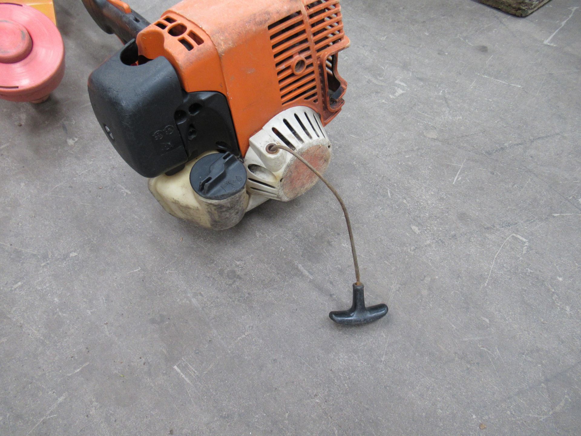 A Stihl multi-tool engine with a Mitox chainsaw head and an unbranded strimmer head (spares/repairs) - Image 3 of 7
