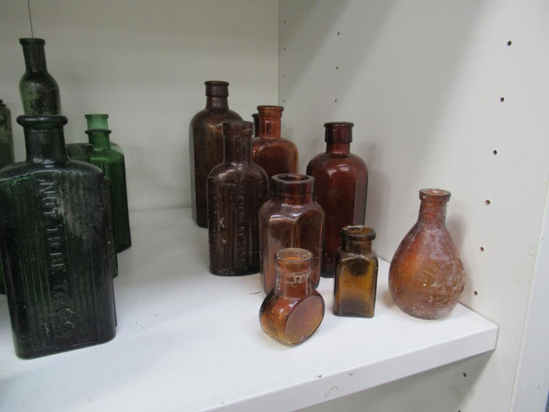 Shelf of Assorted Cobalt Green and Amber Bottles - many saying 'not to be taken' - Image 4 of 4