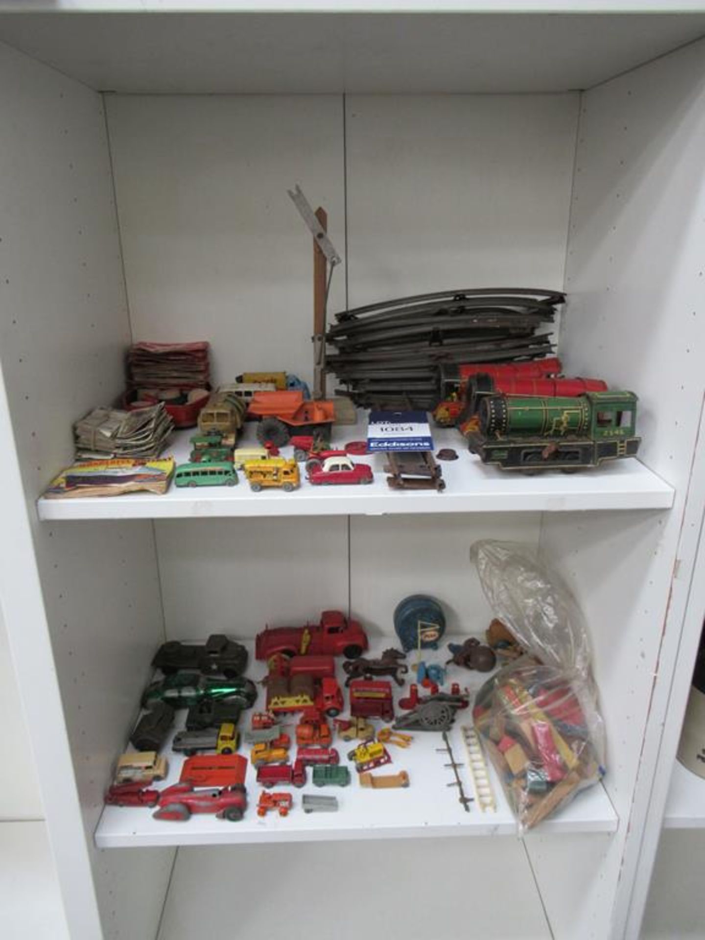 2x Shelves of Assorted Vintage Toys, including diecast vehicles, trains, cigarette cards etc.