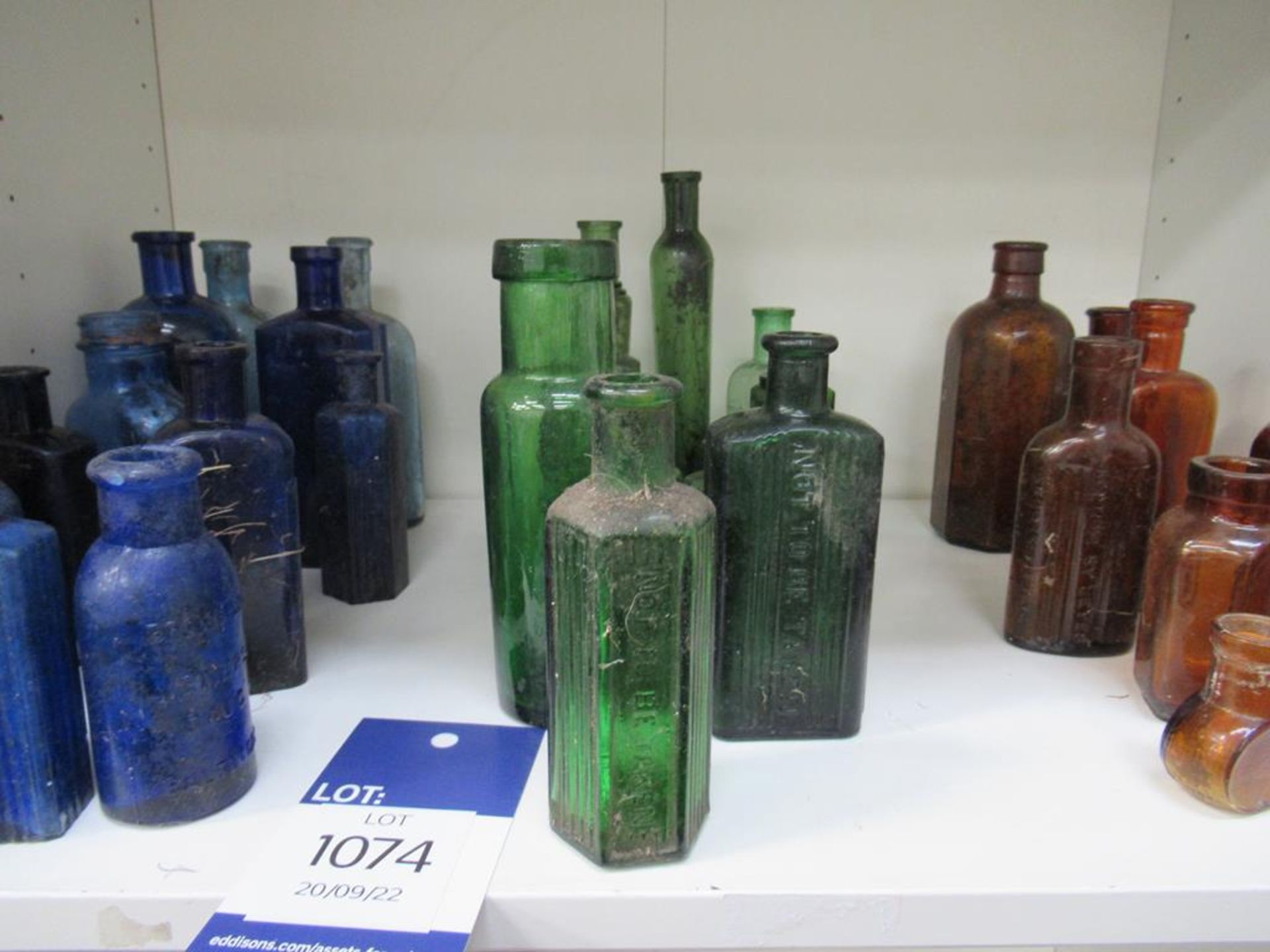Shelf of Assorted Cobalt Green and Amber Bottles - many saying 'not to be taken' - Image 3 of 4