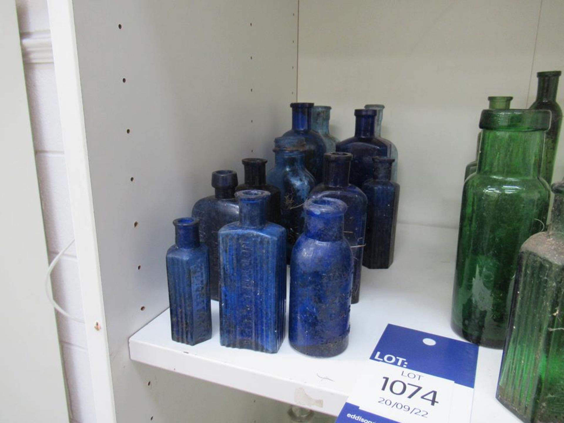 Shelf of Assorted Cobalt Green and Amber Bottles - many saying 'not to be taken' - Image 2 of 4