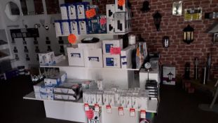 Various stock items to stand to include up/down wall lights, desk lamps, power sockets, bulbs etc.