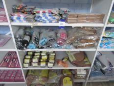 Contents of bay of shelving to include pet travel water bowls, drying towels, grooming kits and