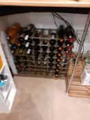 Small quantity of wine (in racks) & quantity of part full spirits & liquers (on bar top)