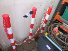 6 red / white barrier posts